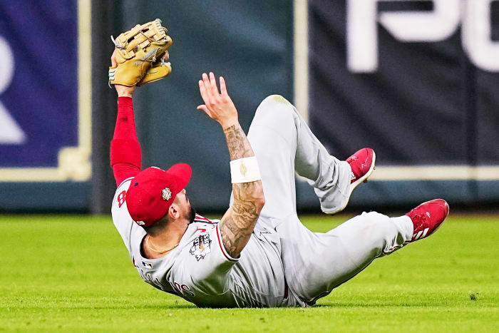Phillies right fielder Nick Castellanos holds up his arms after making a game-saving sliding catch in Game 1 of the World Series vs. the Astros.